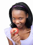 Attractive young woman eating an apple 