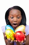 Joyful woman holding colorful Easter eggs 