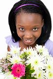 Attractive Afro-american woman holding flowers 