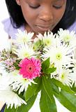 Close-up of a woman smelling flowers 