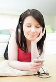 Bright woman listening music with headphones on