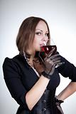 Beautiful woman drinking red wine   