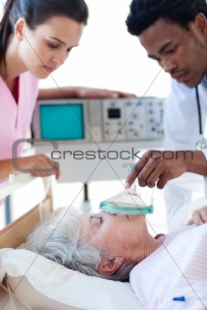 Medical team resuscitating a senior patient