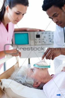 A doctor and a nurse resuscitating a patient