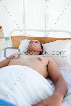 Young patient lying on a hospital bed