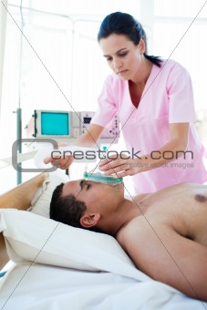 Male patient receiving oxygen mask