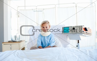 Upset patient with a neck brace sitting on a hospital bed
