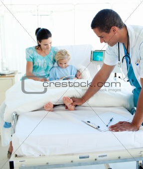 Young doctor examining a child patient