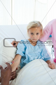 Upset child patient receiving an injection