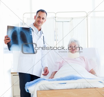A doctor showing an x-ray to a patient