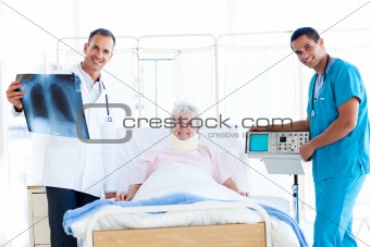 Senior patient looking at an x-ray with her doctor