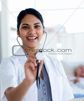 Female doctor holding a stethoscope