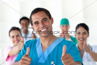 Attractive doctor with thumbs up 
