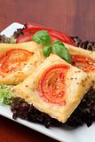 Puff pastry with cheese and tomatoes