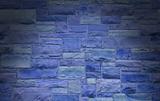 Blue masonry wall lit dramatically