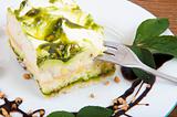 Sweet pistachio dessert with vanilla cream and nuts