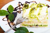 Sweet pistachio dessert with vanilla cream and nuts