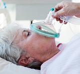 Close-up of a female patient receiving oxygen mask