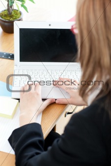 Close-up of a businesswoman working at a laptop