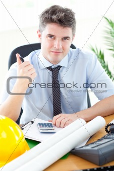 Handsome male architect studying a project