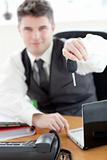 Self-assured businessman holding car's key