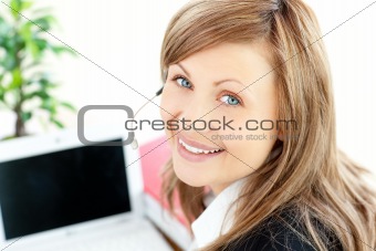 Beautiful businesswoman with headset on smiling at the camera