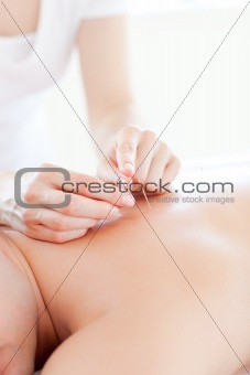 Close-up of a young man in an acupuncture therapy 