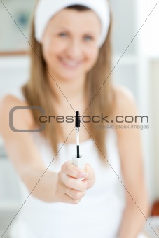 Delighted woman is holding make-up 