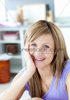 Teen woman looking at the camera in the kitchen 