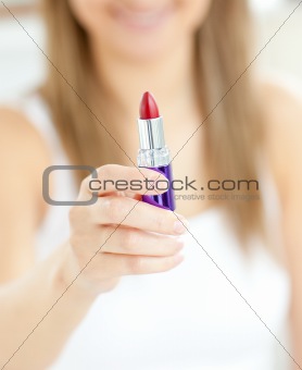 Close-up of woman holding a lipstick 