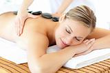 Relaxed woman having a massage in a spa