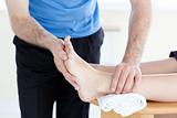 Close-up of a physical therapist giving a foot massage 