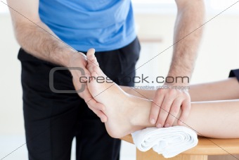 Close-up of a physical therapist giving a foot massage 