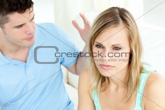 Young couple having an argue in the living-room 