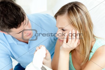 Tired couple having an argue in the living-room 