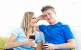 Cute couple drinking wine together in the living-room 