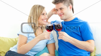 Charming couple drinking wine together 