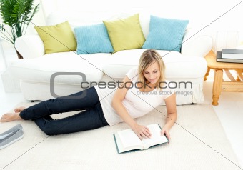 Charming woman is reading a book 