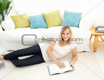 Cute woman is reading a book 