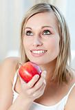 Beautiful woman eating an apple 