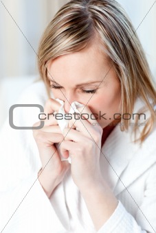 Sick woman blowing 