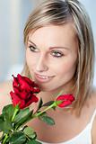 Portrait of a cute woman holding roses 