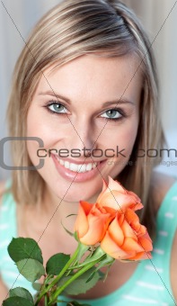 Portrait of a delighted woman holding roses 
