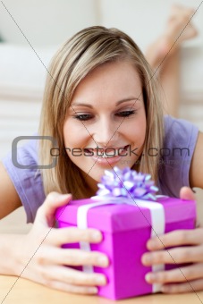 Jolly woman holding a gift 