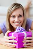 Smiling woman holding a gift 