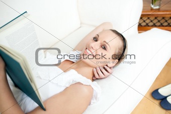 Attractive woman reading a book 