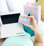 Close-up of a woman shopping on-line at home 
