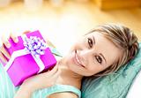 Smiling woman holding a present