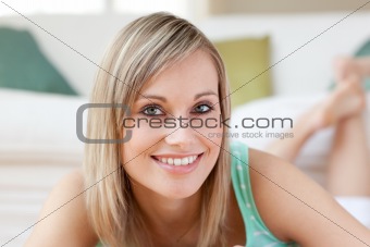 Bright woman lying on the floor
