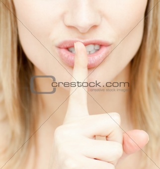Close-up of a woman asking for silence 
